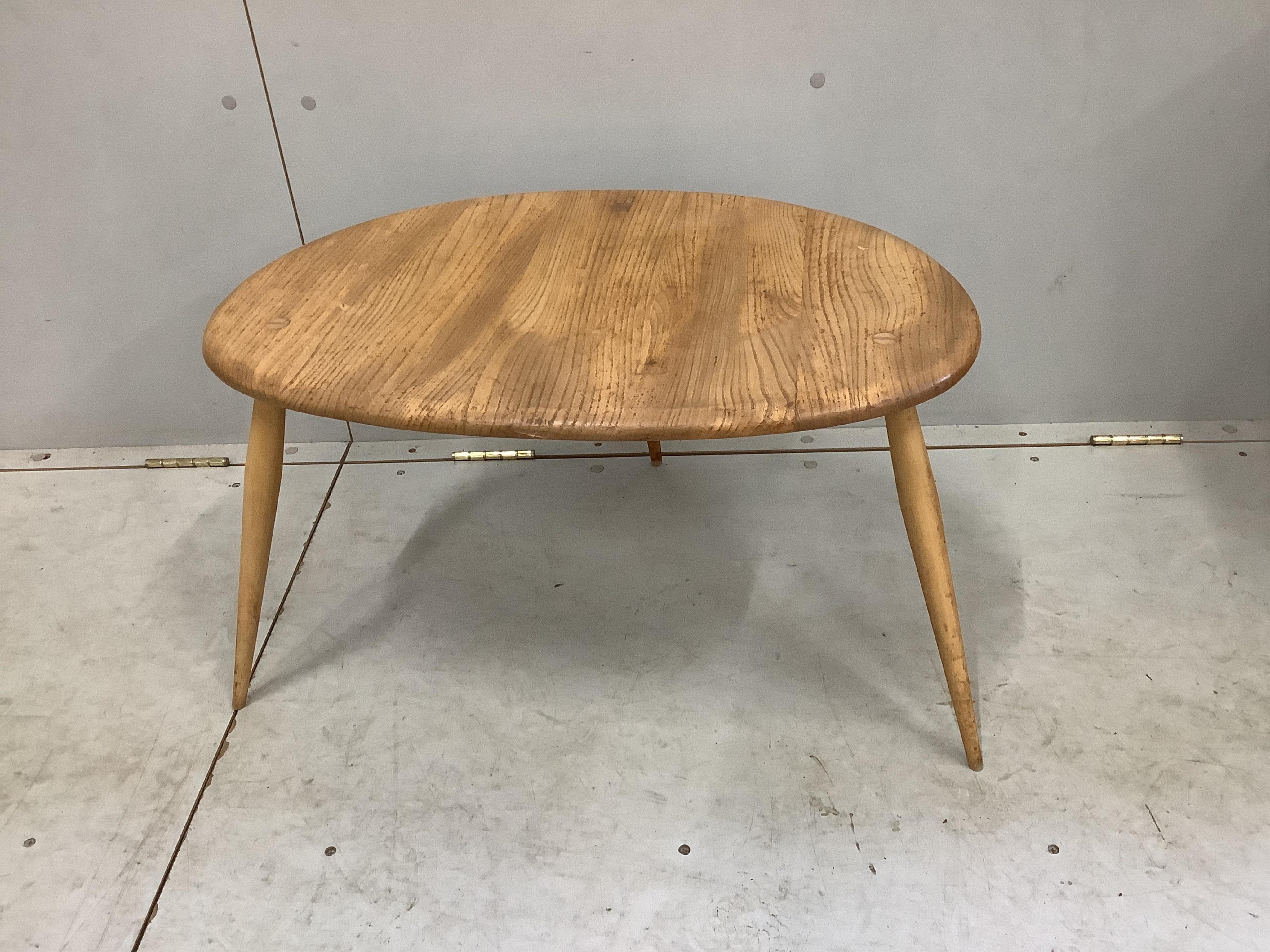 An Ercol oval elm coffee table and a nest of two tables, largest width 98cm, depth 84cm, height 44cm. Condition - poor